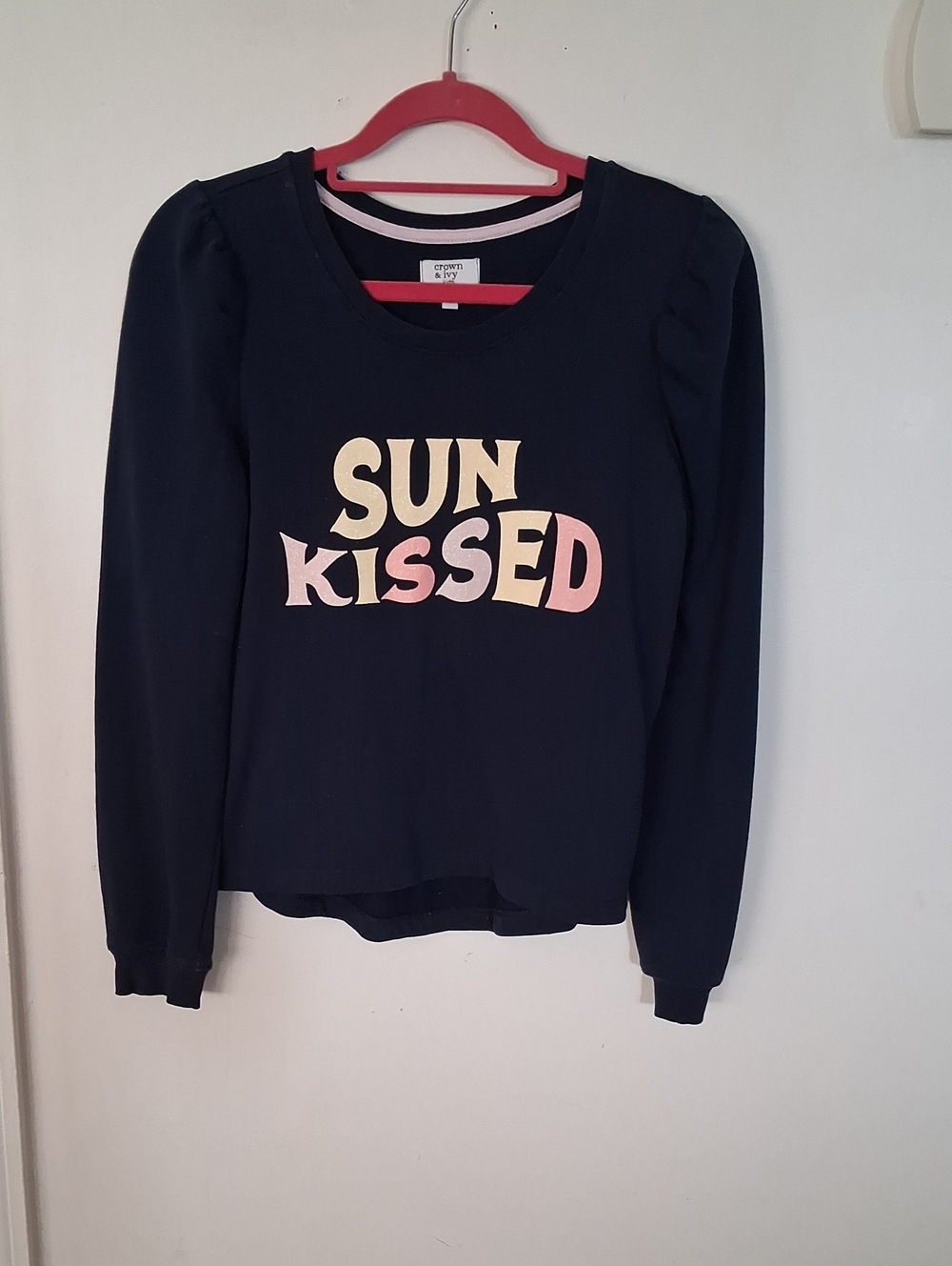 crown & ivy navy pullover with 'SUN KISSED' pastel graphic